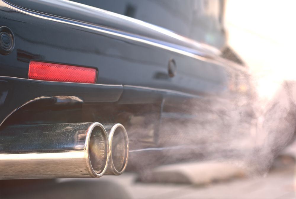 Black Car Exhaust Billowing — Jims Auto Care in Berrimah, NT