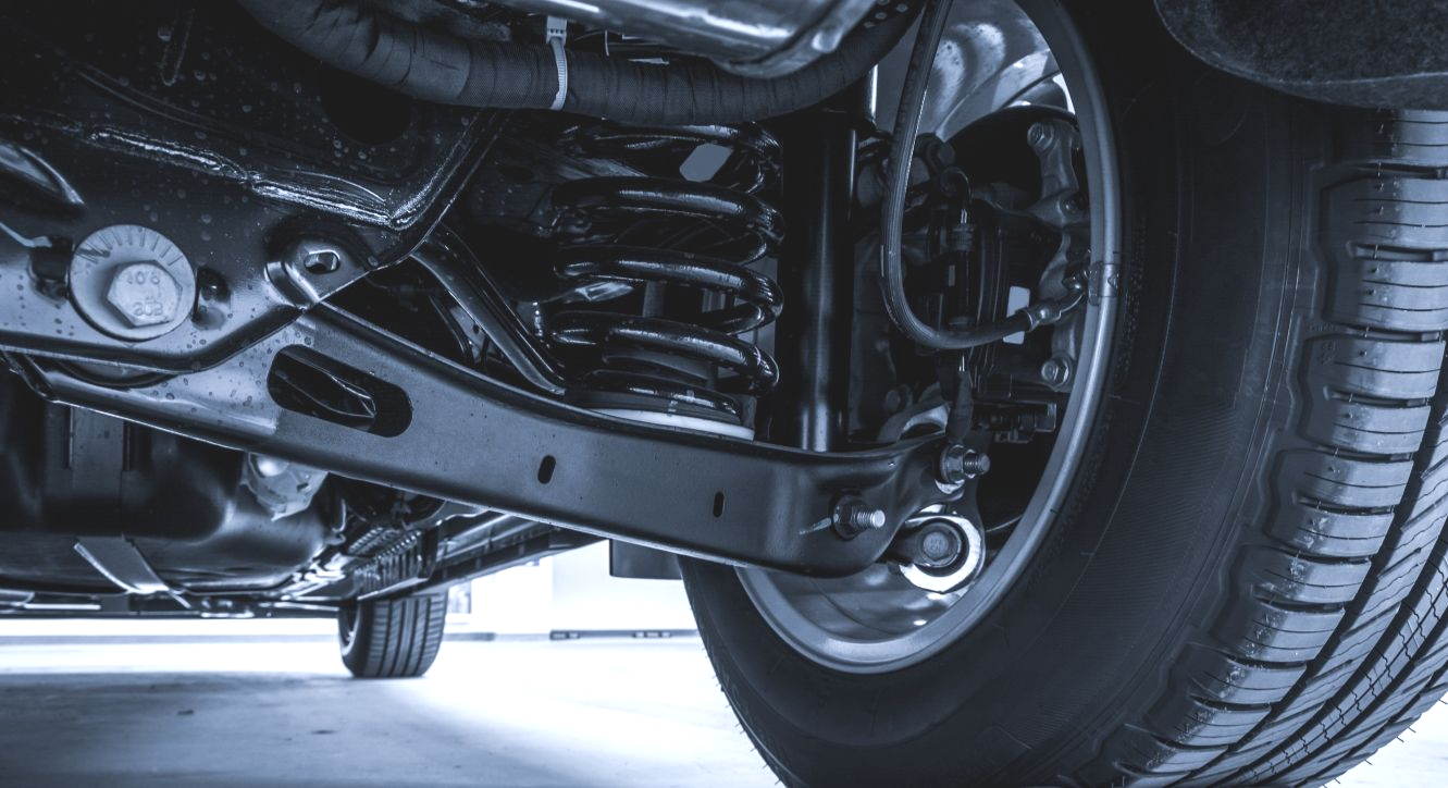 Black Car Suspension System With Tire, Spring — Jims Auto Care in Berrimah, NT