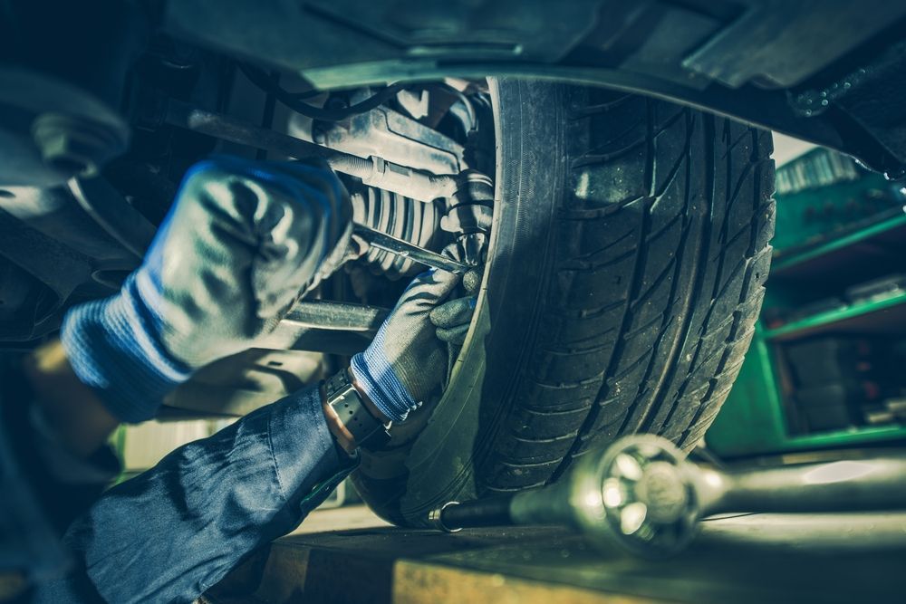 Mechanic Working on the Underside of a Car — Jims Auto Care in Berrimah, NT