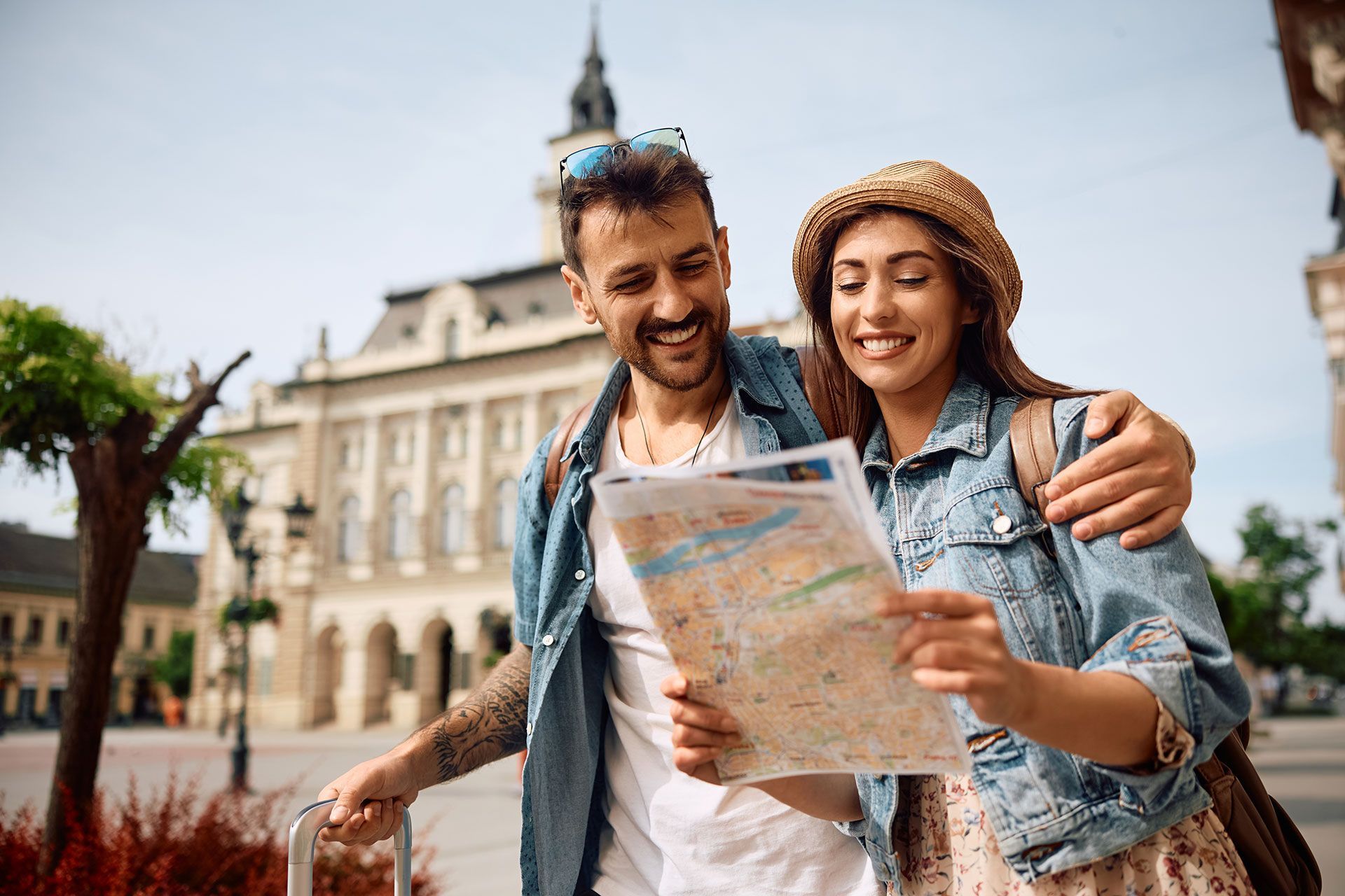 A man and a woman are looking at a map.