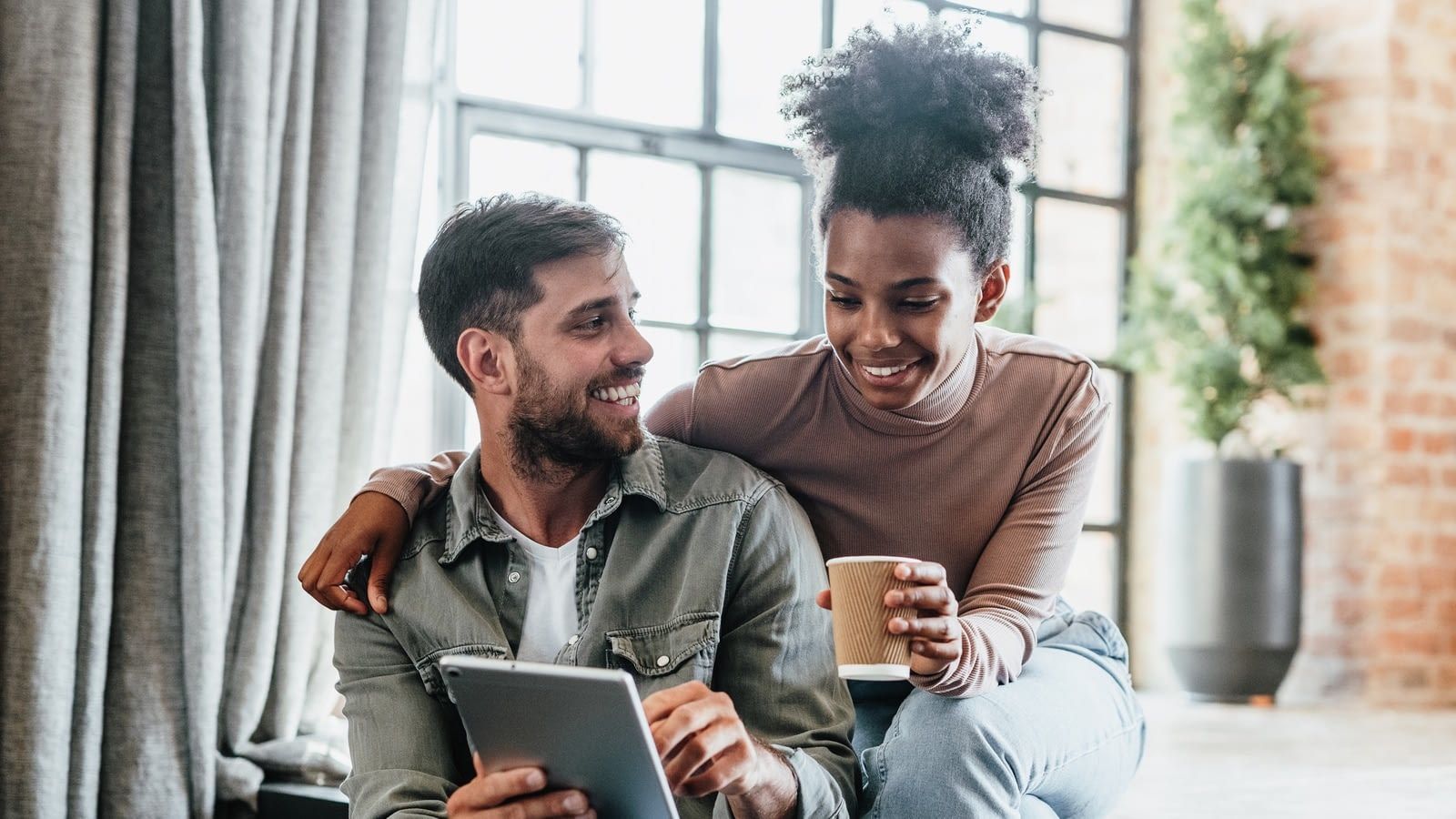 convertible life insurance young couple looking at ipad