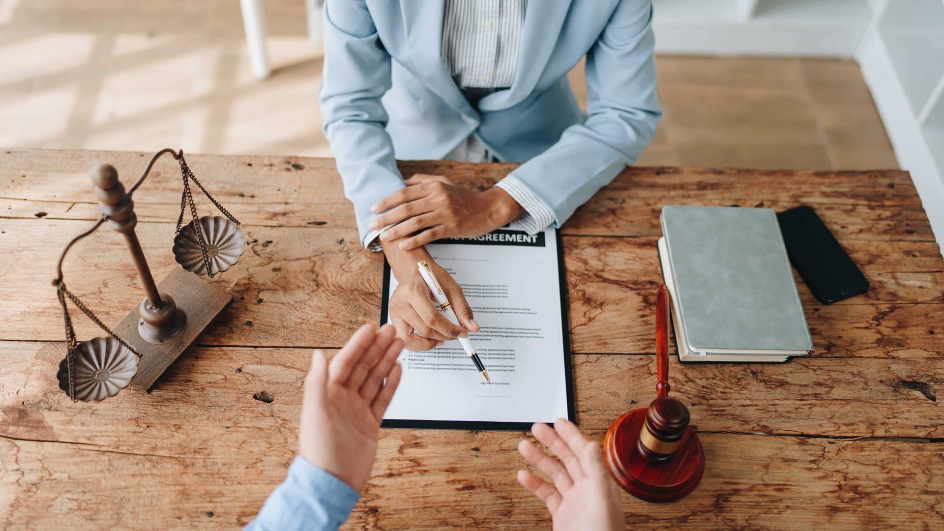7-19 Blog Image woman in suit explaining policy agreement with pen