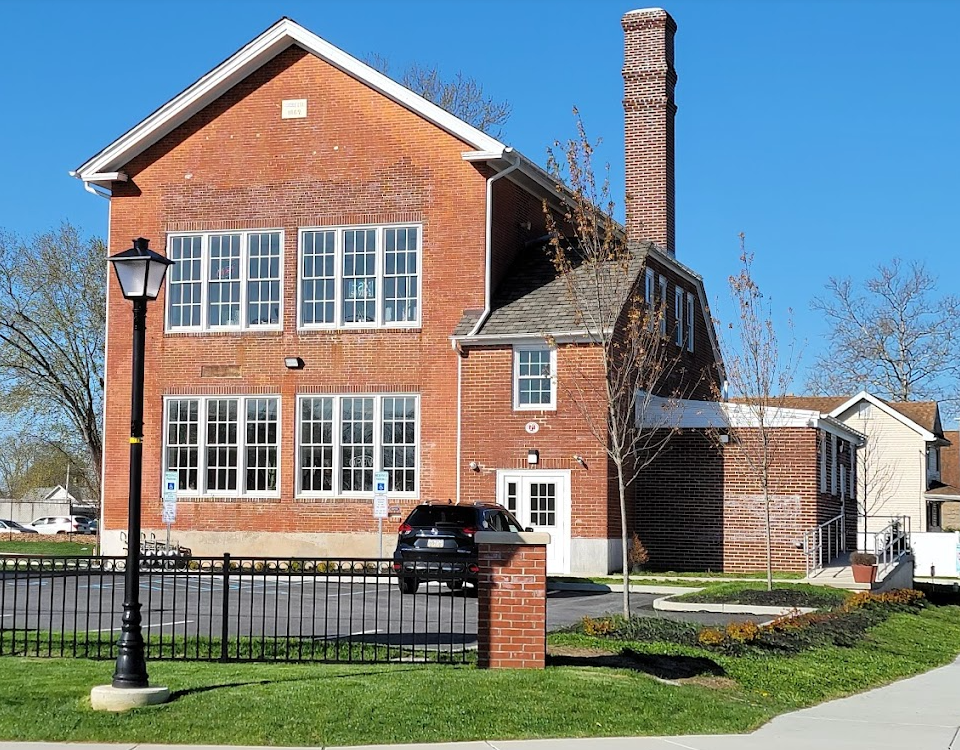 A large brick building with a sign that says ' brick ' on it