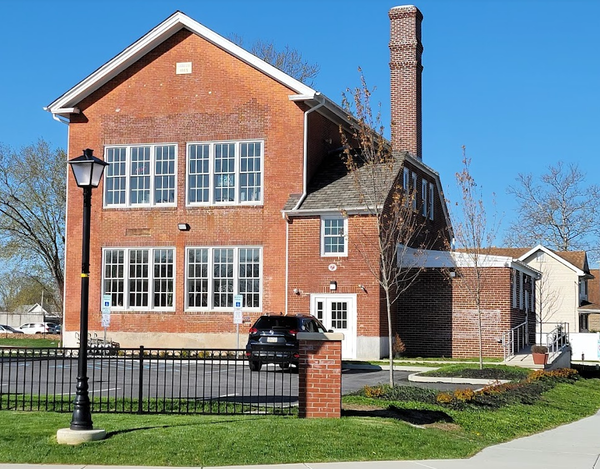 A large brick building with a sign that says ' brick ' on it