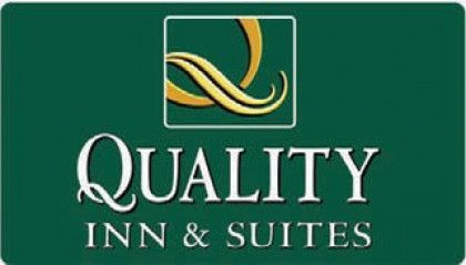 Quality Inn & Suites logo on green background with gold and white lettering