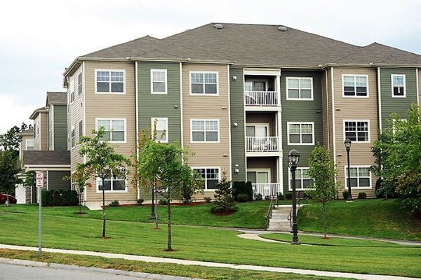 A large apartment building with a lot of windows