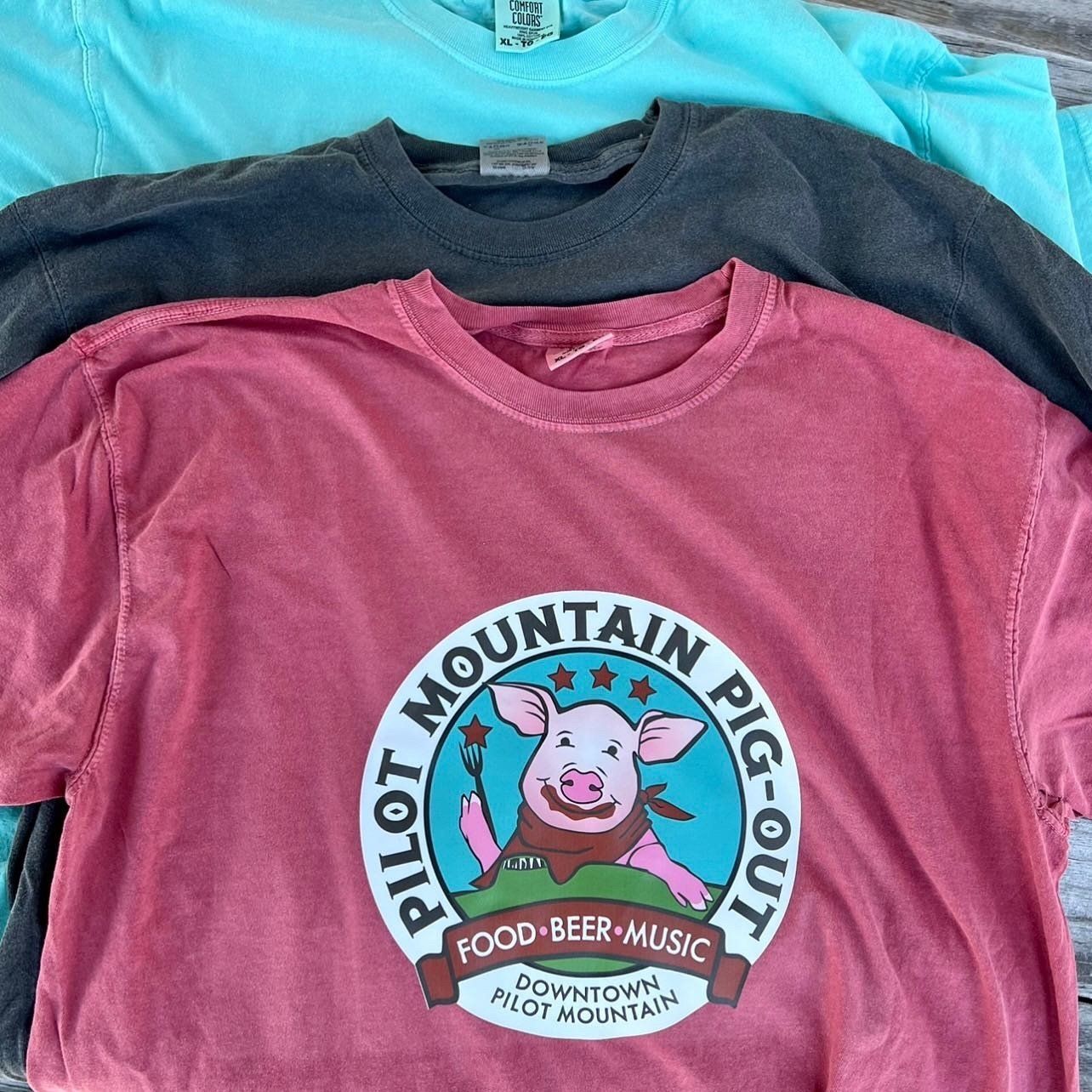 Heat press t-shirts for an event in Pilot Mountain, NC. Shirts have pigs with fork, bib, and BBQ sauce on mouth