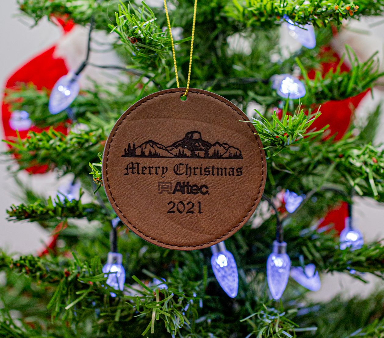 Laser engraved leather ornament hanging on Christmas tree