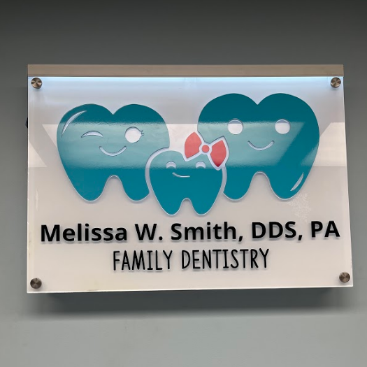 Acrylic signage for dentist with teeth shaped family