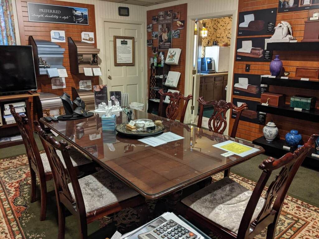 a conference room with a large table and chairs