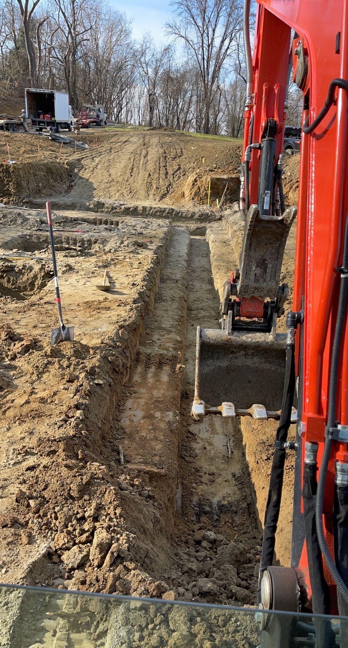 Excavator digging a trench