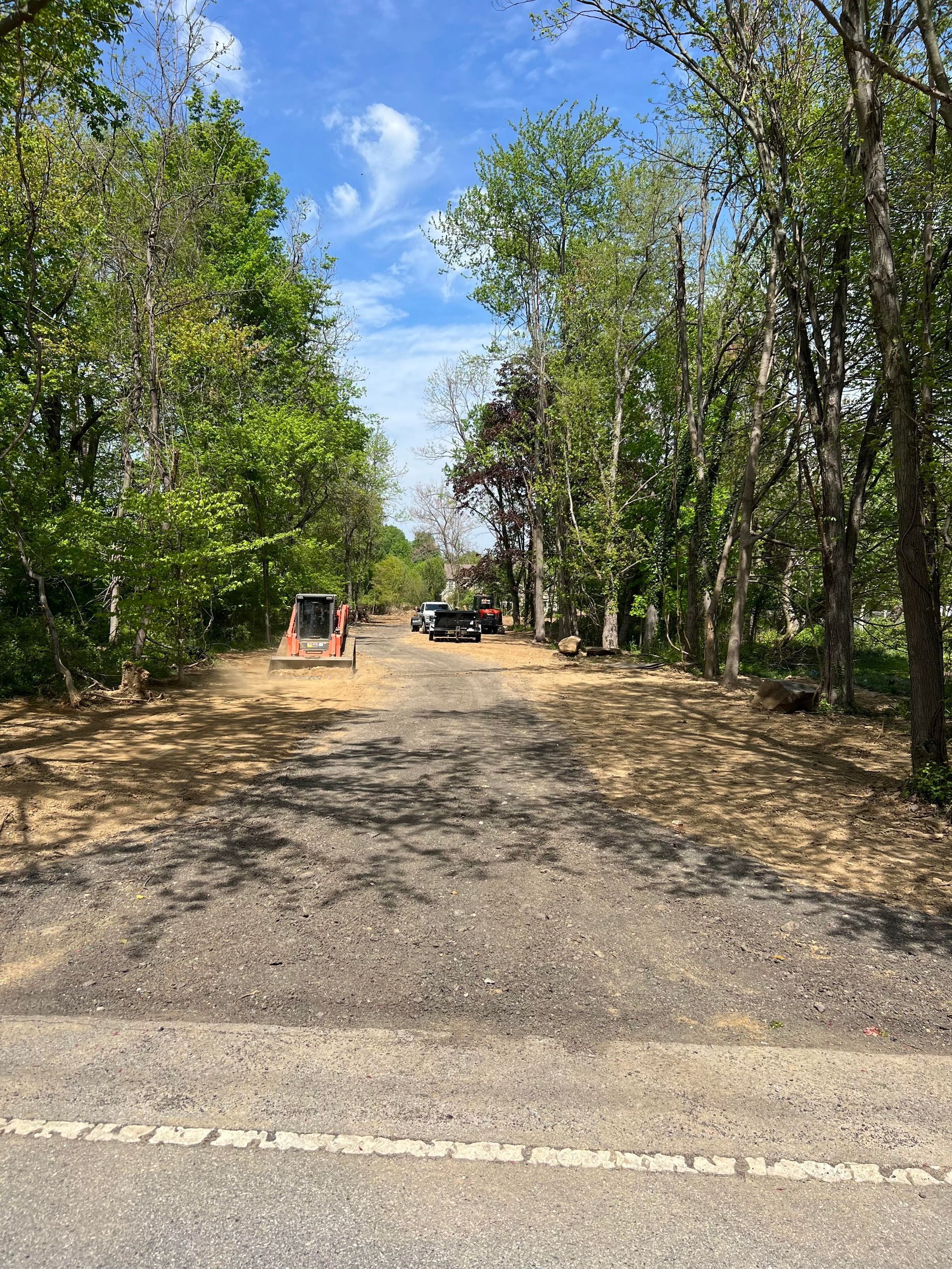 A gravel path through a wooded area
