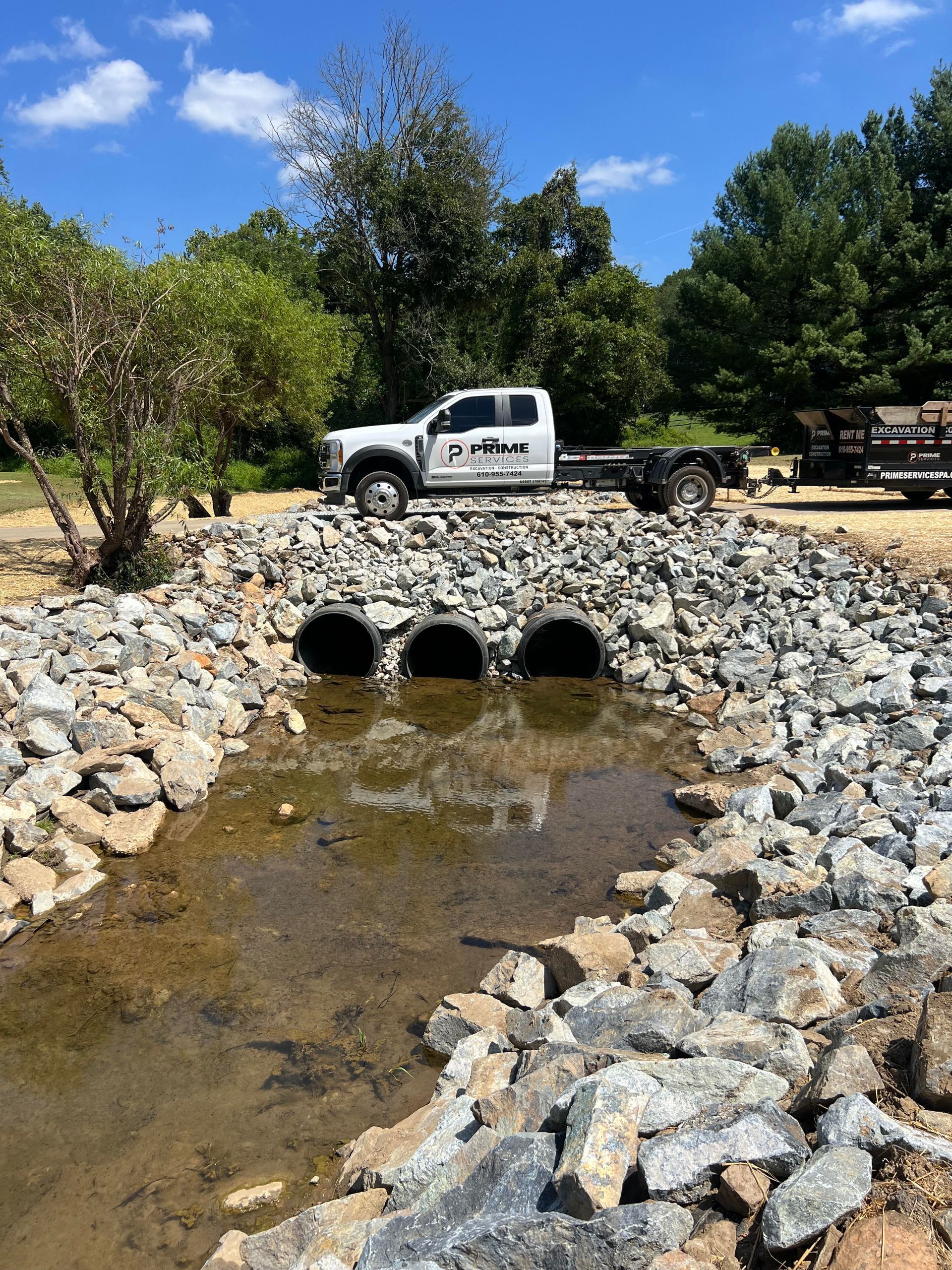 Truck over three-pipe riprap culvert