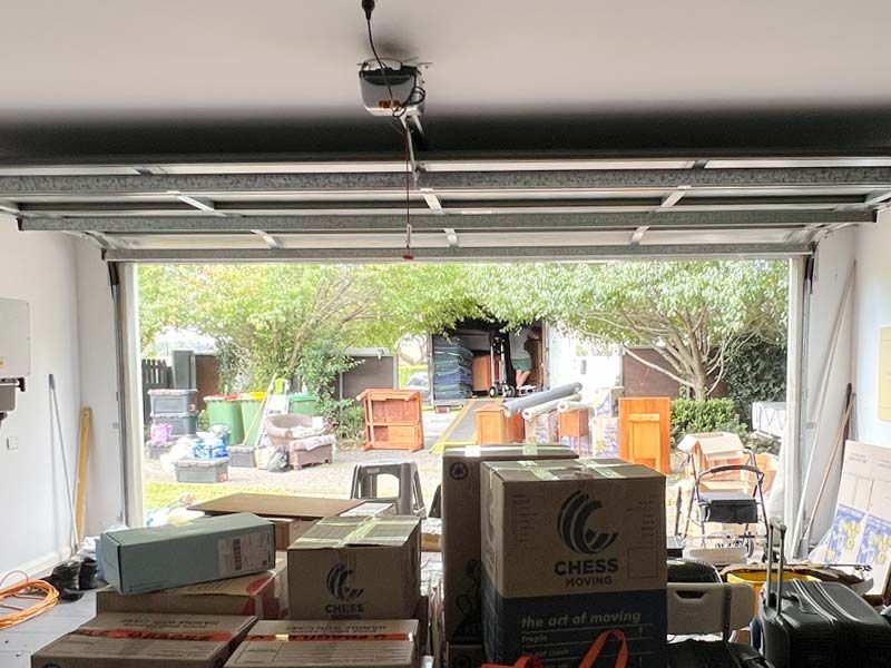 A storage unit filled with appliances including a refrigerator