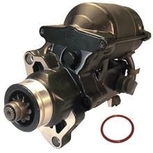 A close up of a starter motor on a white background.