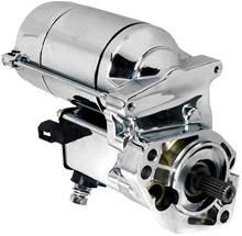 A close up of a chrome starter motor on a white background.