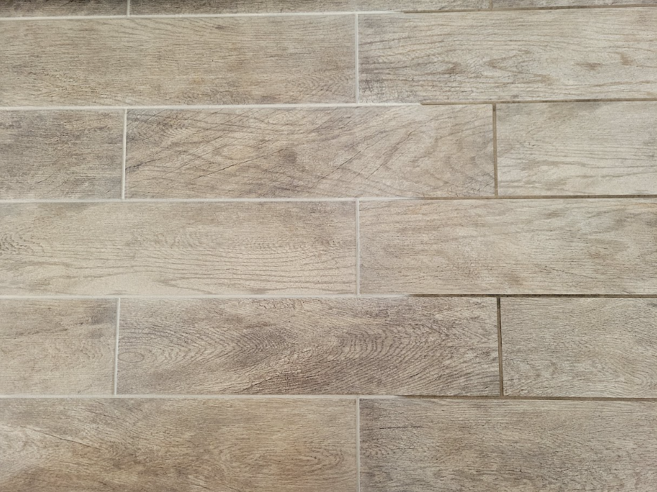 Beige textured tile wall with rectangular stone-pattern panels