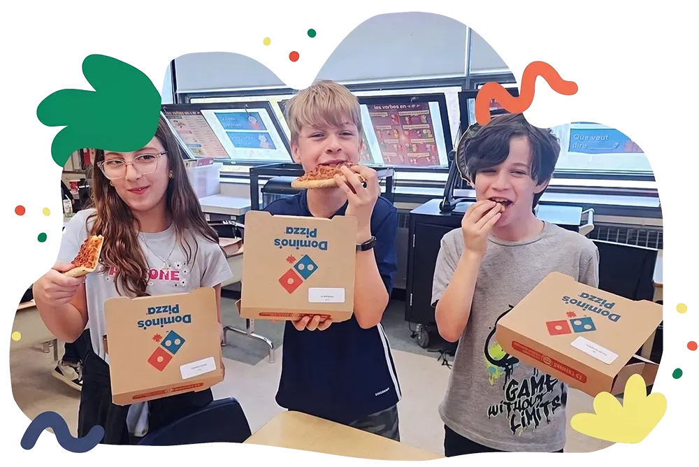 Three people holding snack boxes in a bright indoor arcade-like setting