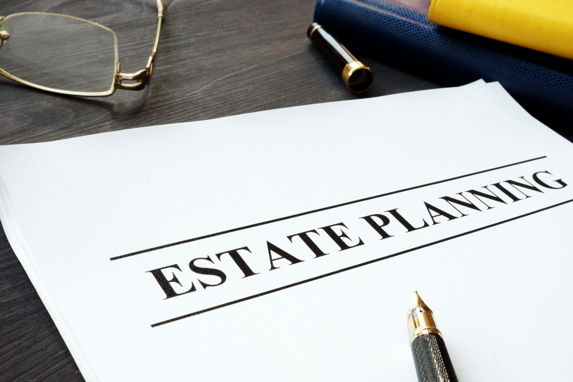 Estate planning document on a desk with eyeglasses and a pen