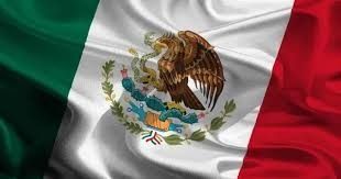 Bandera mexicana con franjas verticales verdes, blancas y rojas y el escudo nacional en el centro.