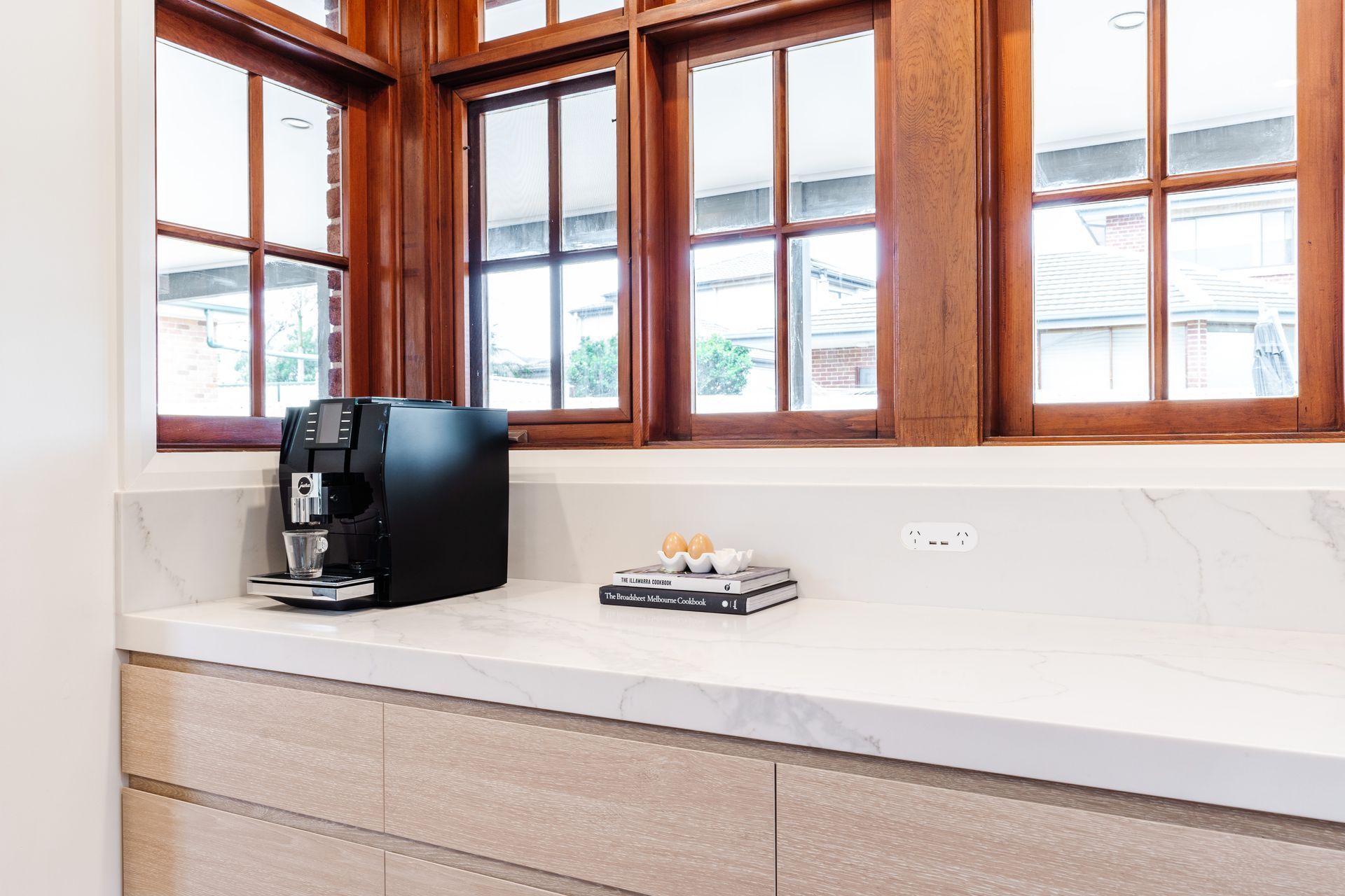 Modern Kitchen Counter With Coffee Maker, Tray, and Large Windows — PKJ Design in Unanderra, NSW
