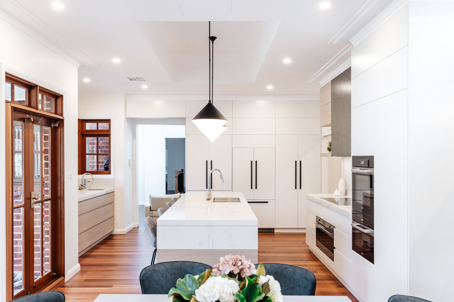 Bright Modern Kitchen With White Cabinets — PKJ Design in Unanderra, NSW