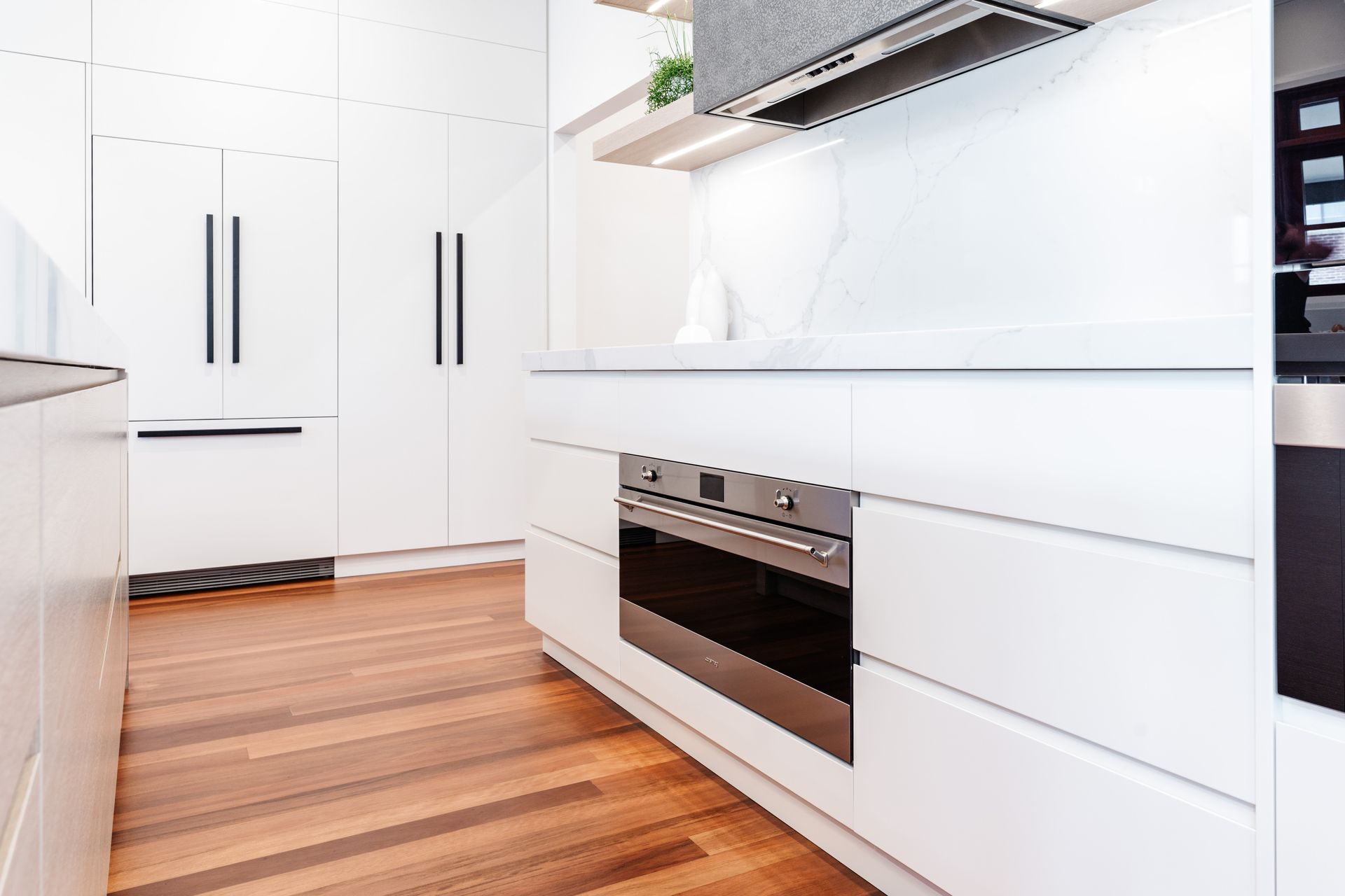 Bright Modern Kitchen With White Cabinets — PKJ Design in Unanderra, NSW