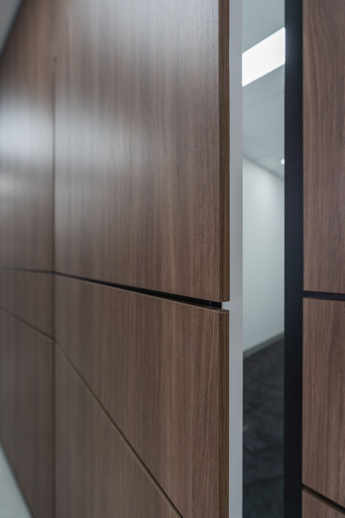 Modern Wood-paneled Hallway With a Narrow Doorway — PKJ Design in Unanderra, NSW