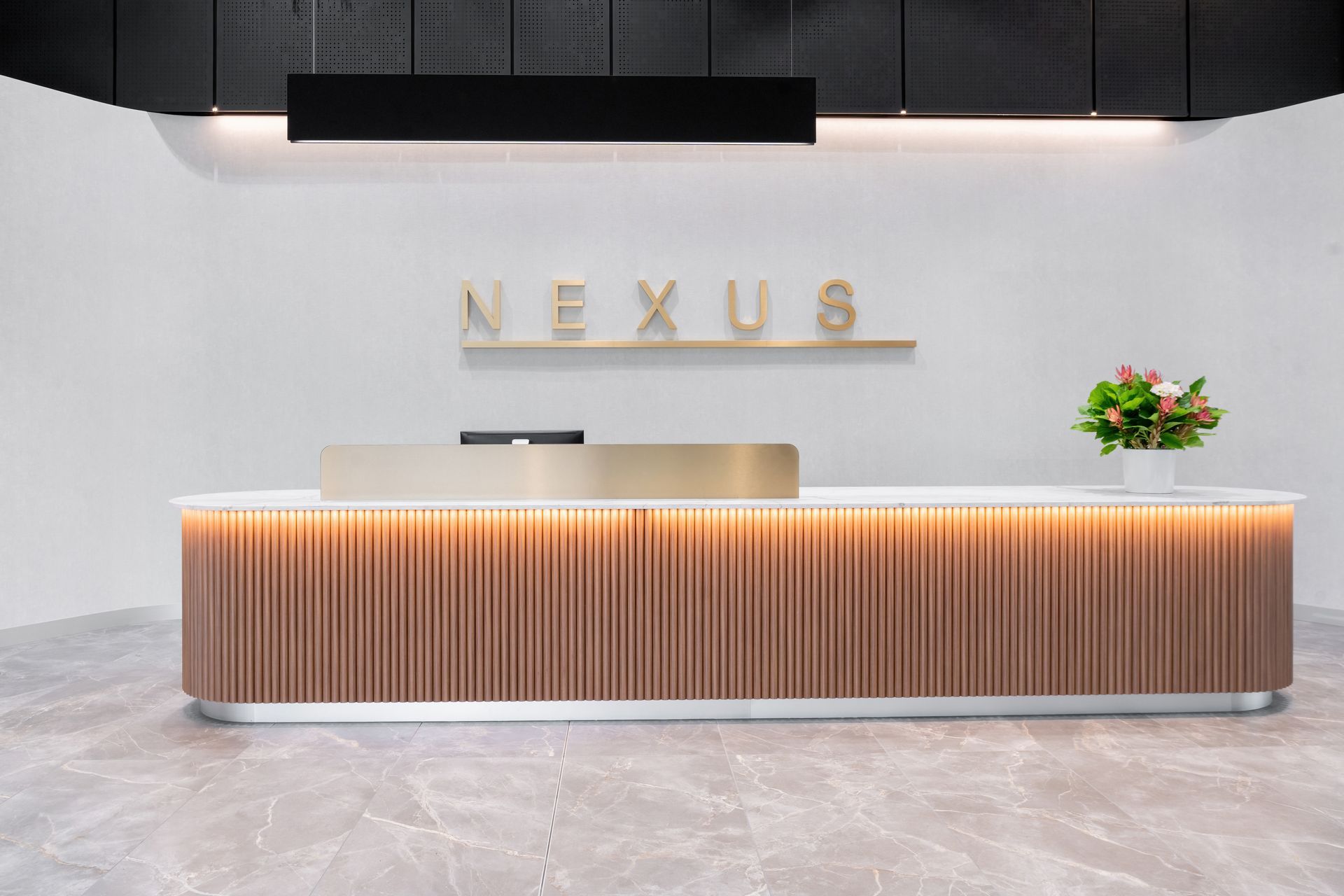Reception Desk With Wood Paneling and Nexus Sign — PKJ Design in Unanderra, NSW