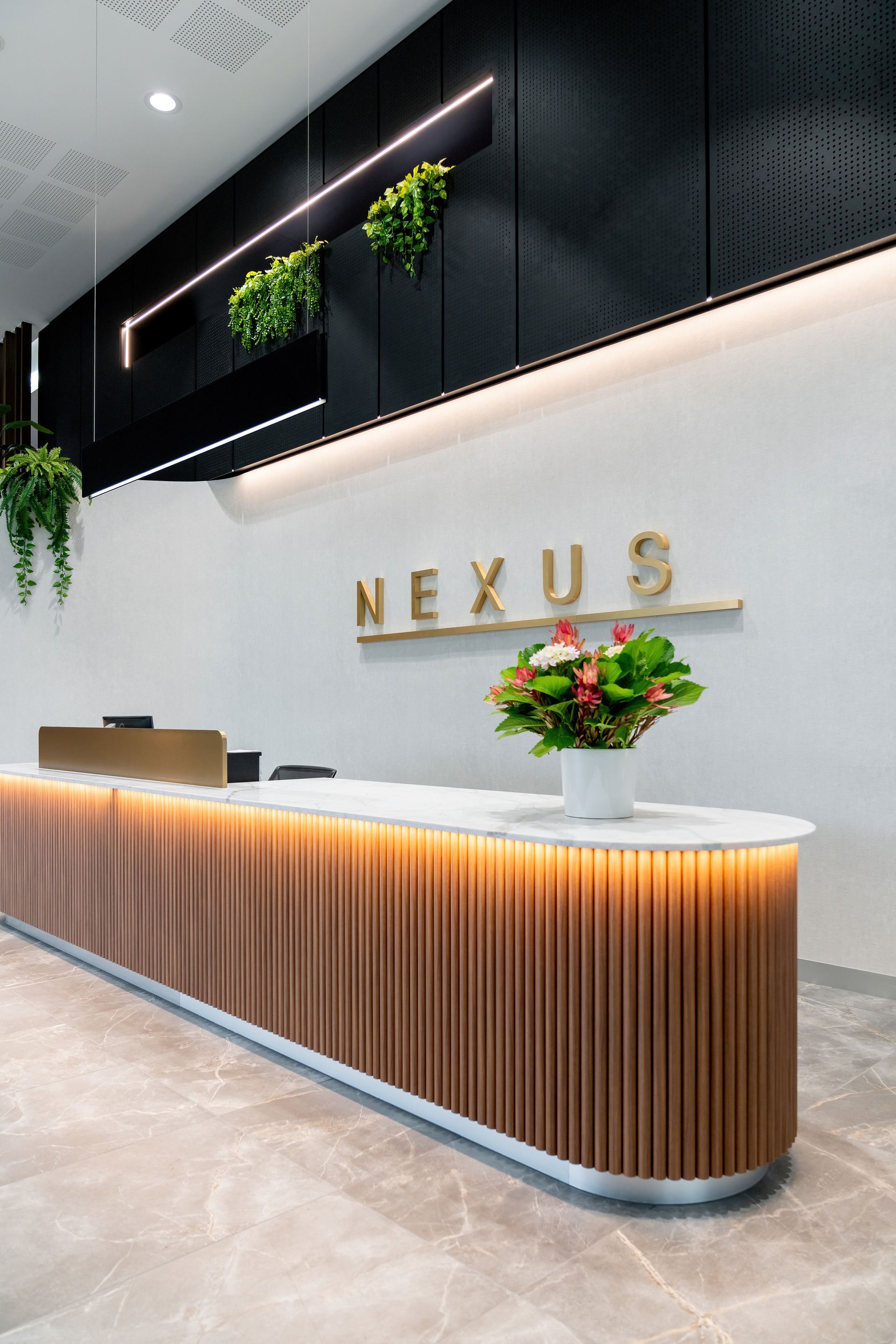 Modern Lobby Reception Desk With Wood Slats — PKJ Design in Unanderra, NSW