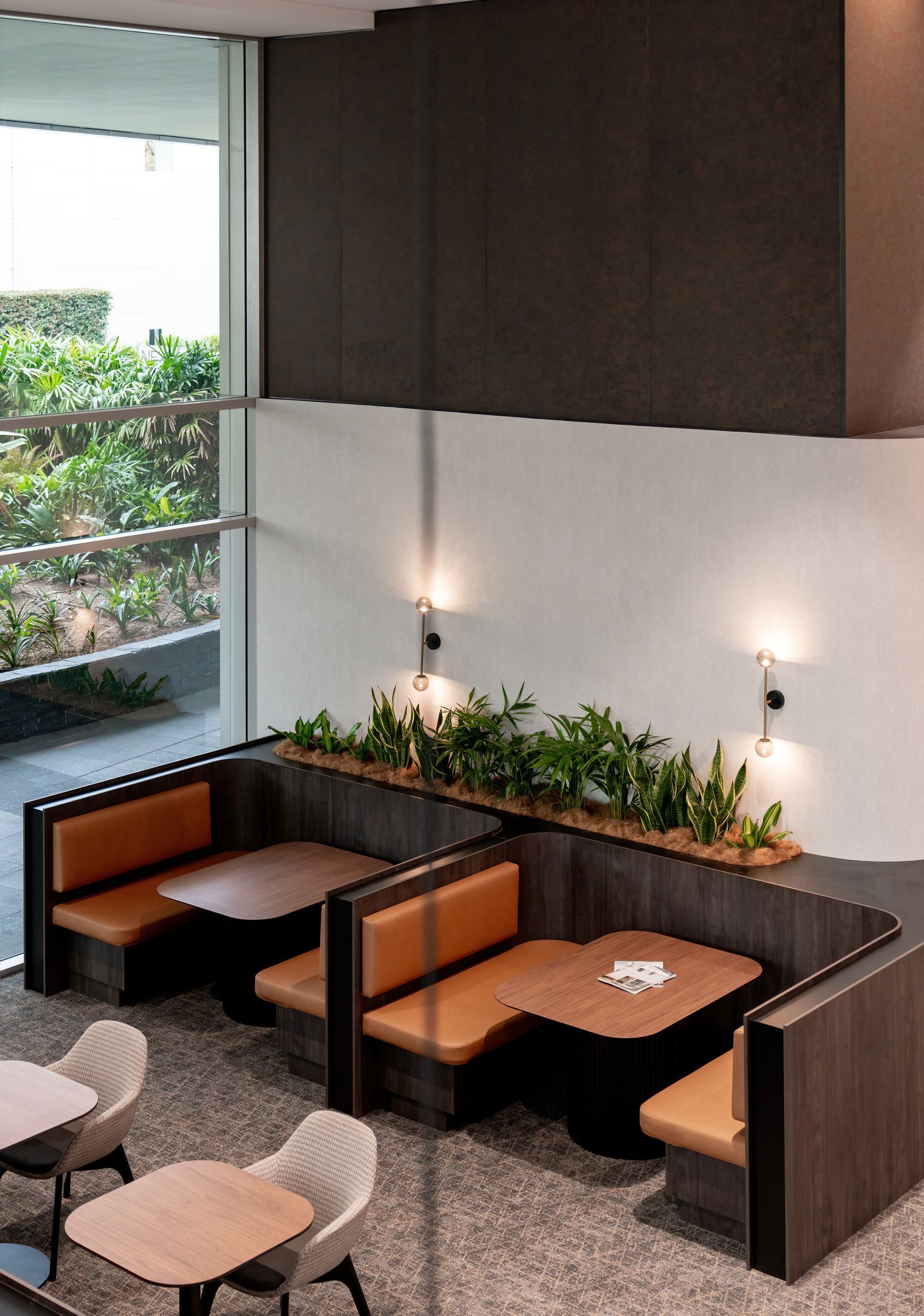 Modern Café Booth Seating With Dark Wood Walls — PKJ Design in Unanderra, NSW