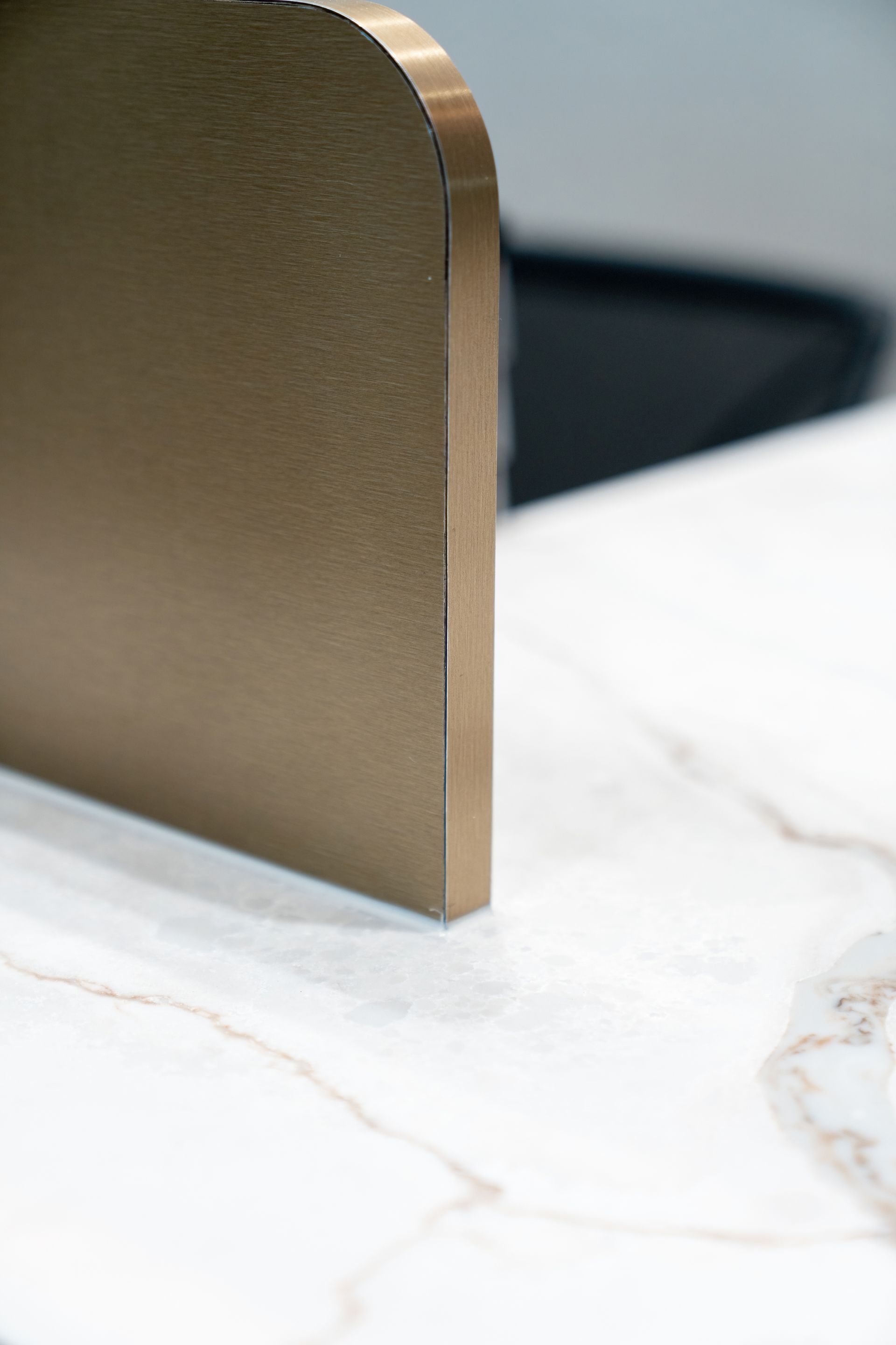 Brass Bookend on a White Marble Surface — PKJ Design in Unanderra, NSW