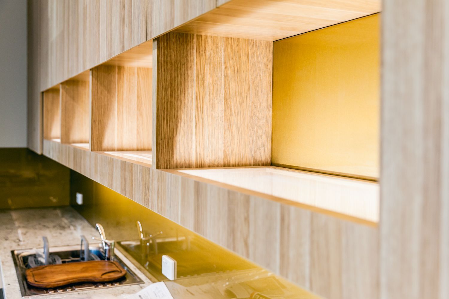 Modern Kitchen With Wood Cabinets, Backsplash, and a Countertop — PKJ Design in Unanderra, NSW