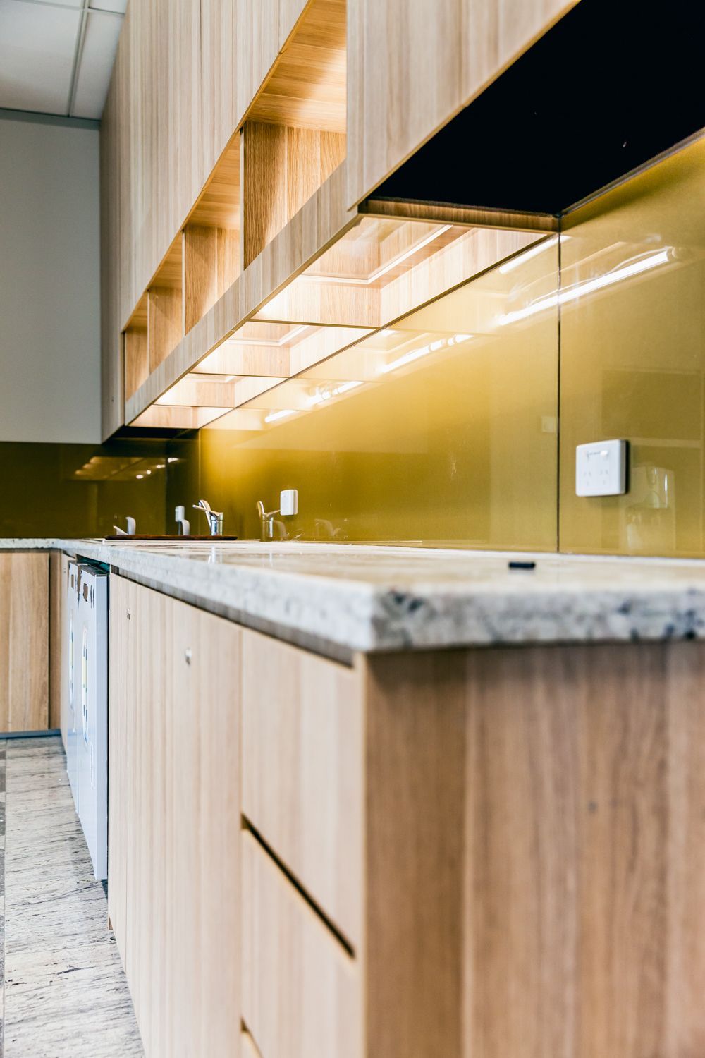 Modern Kitchen With Light Wood Cabinets — PKJ Design in Unanderra, NSW