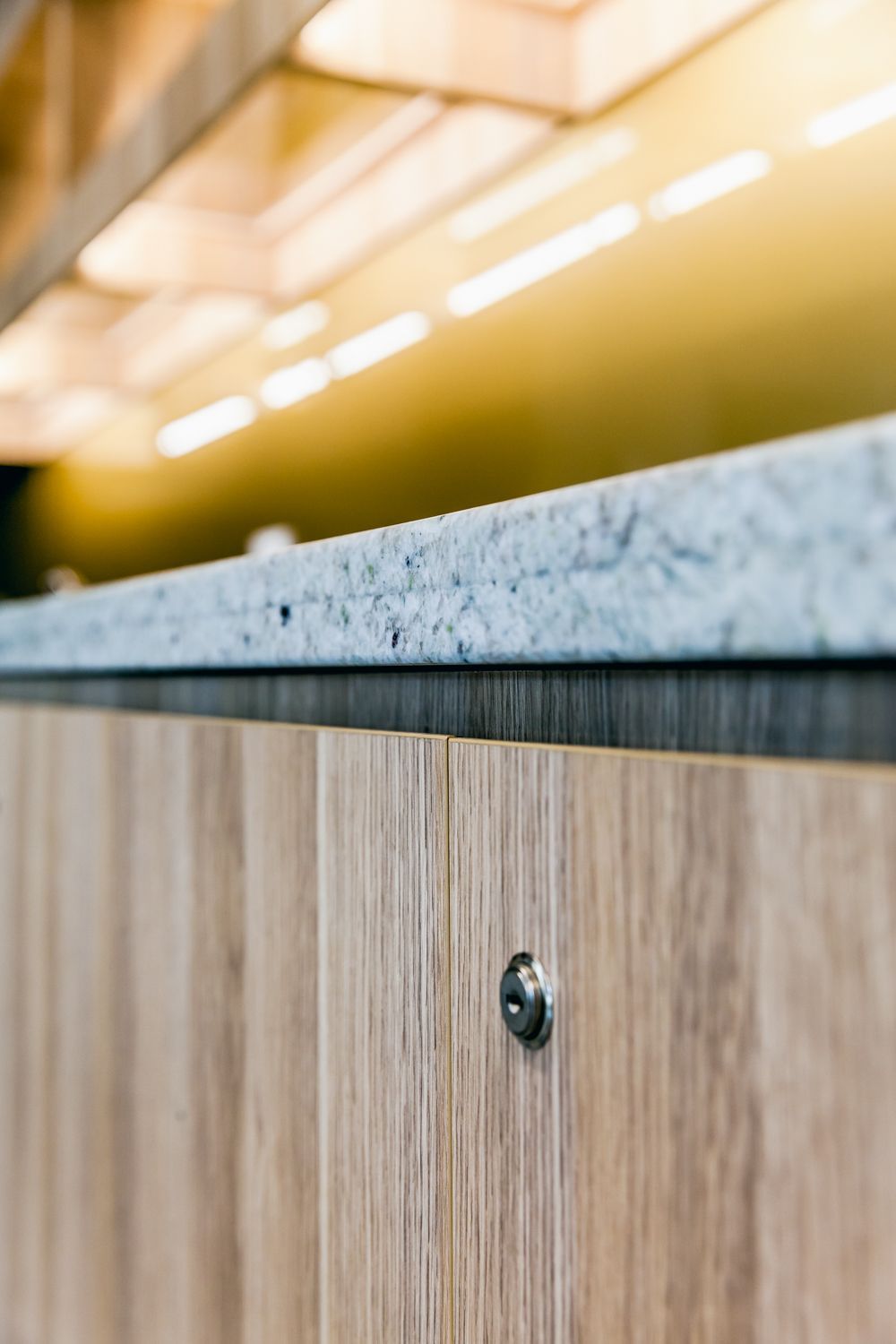 Close-up of a Wooden Cabinet With a Stone Countertop — PKJ Design in Unanderra, NSW