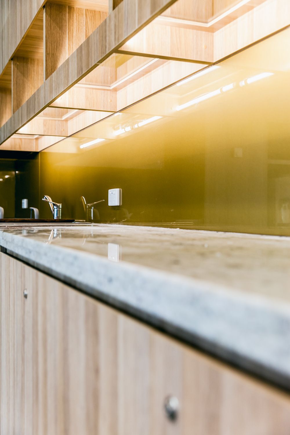 Modern Bathroom With Gold Mirrored Wall — PKJ Design in Unanderra, NSW