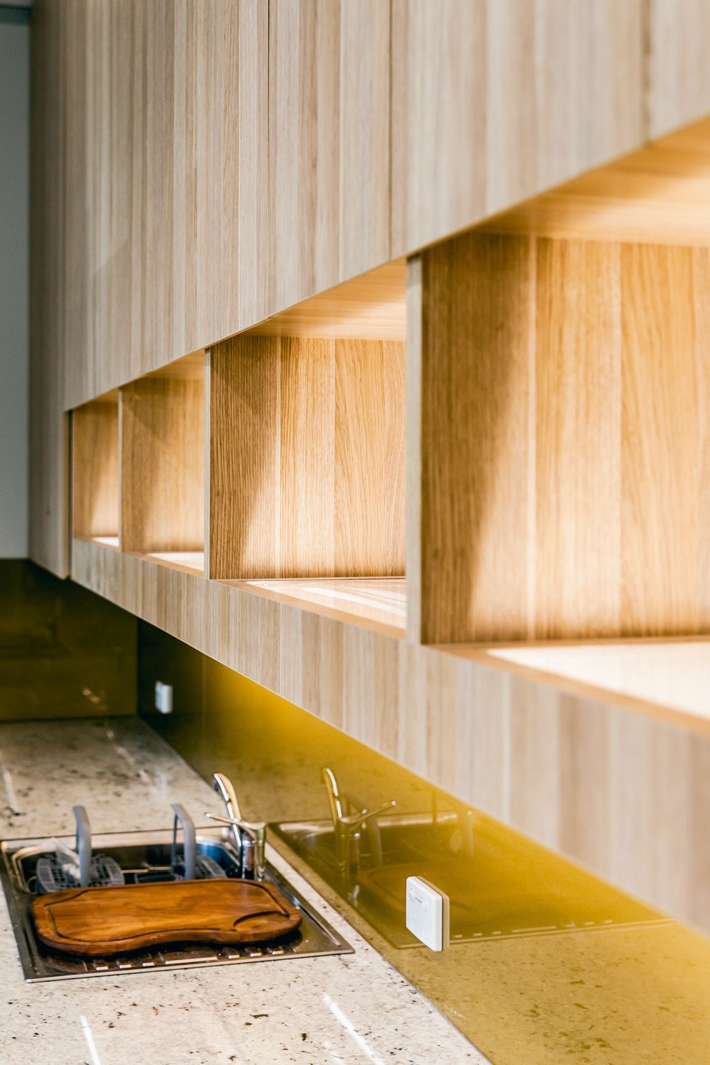Modern Kitchen Counter With Sink and Wooden Shelving — PKJ Design in Unanderra, NSW