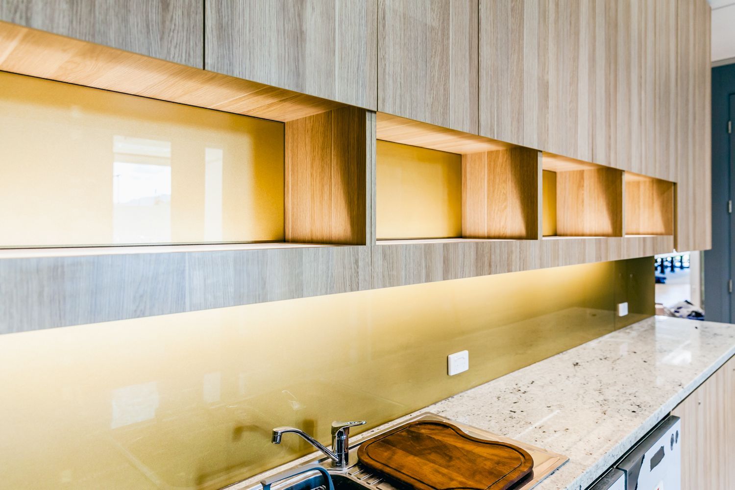 Modern Kitchen With Wood Cabinets — PKJ Design in Unanderra, NSW