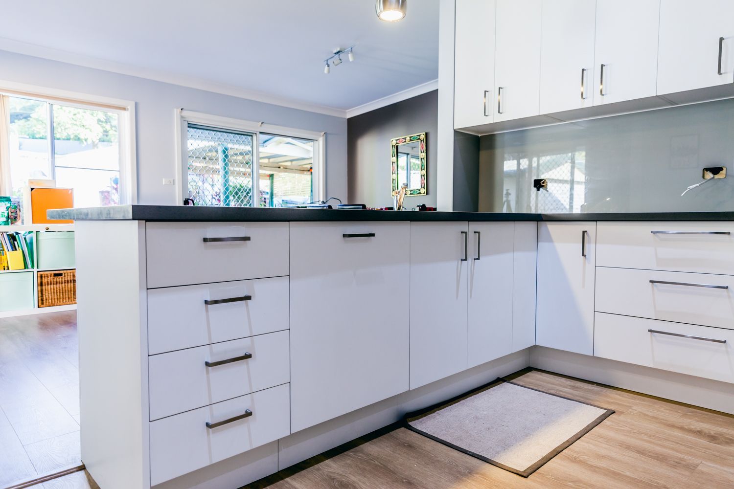 Bright Modern Kitchen With White Cabinets — PKJ Design in Unanderra, NSW