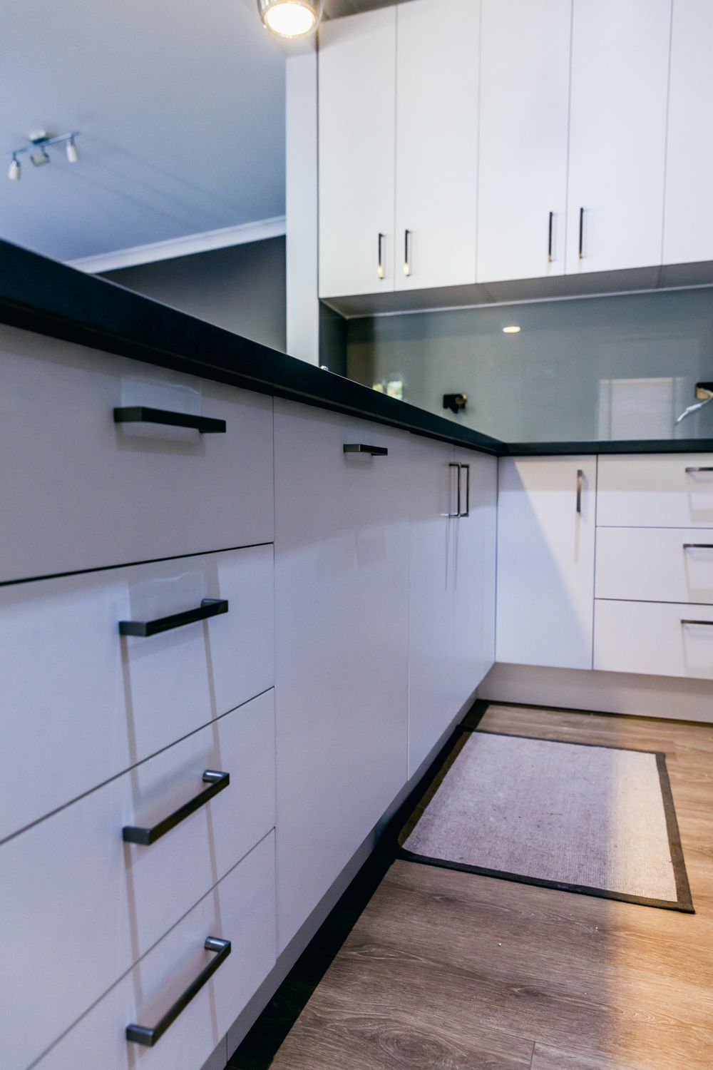 Bright Modern Kitchen With White Cabinets — PKJ Design in Unanderra, NSW