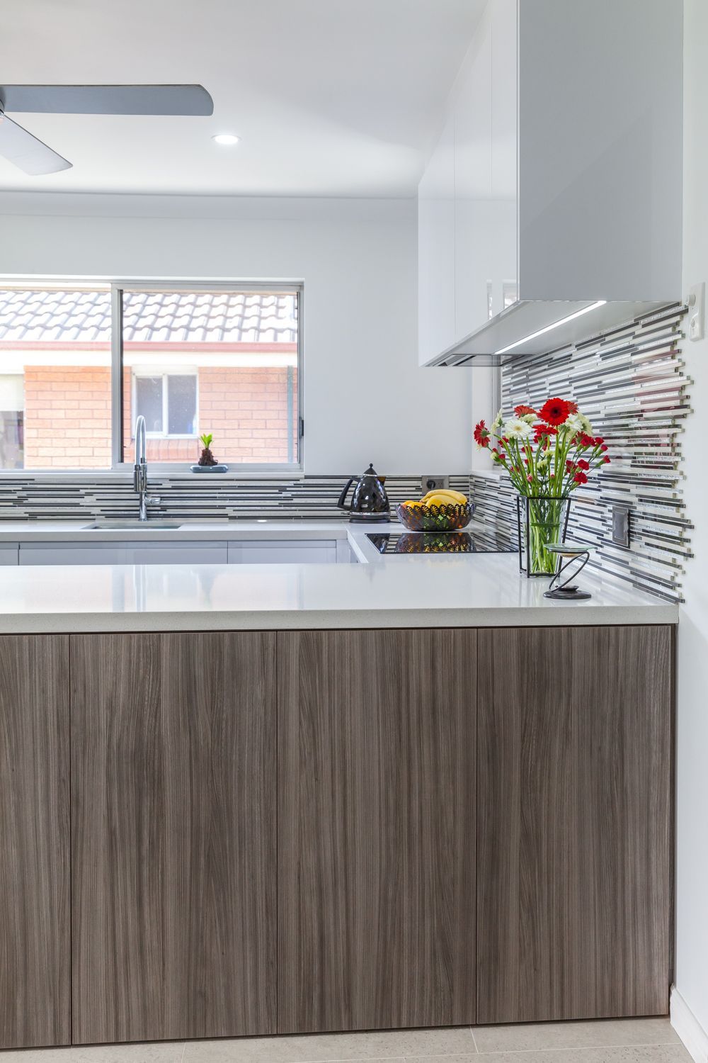 Modern Kitchen With Wood Cabinets — PKJ Design in Unanderra, NSW