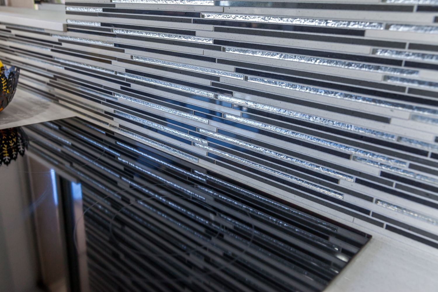 Close-up of Stacked Long Metal Rods or Rails in a Storage Rack — PKJ Design in Unanderra, NSW