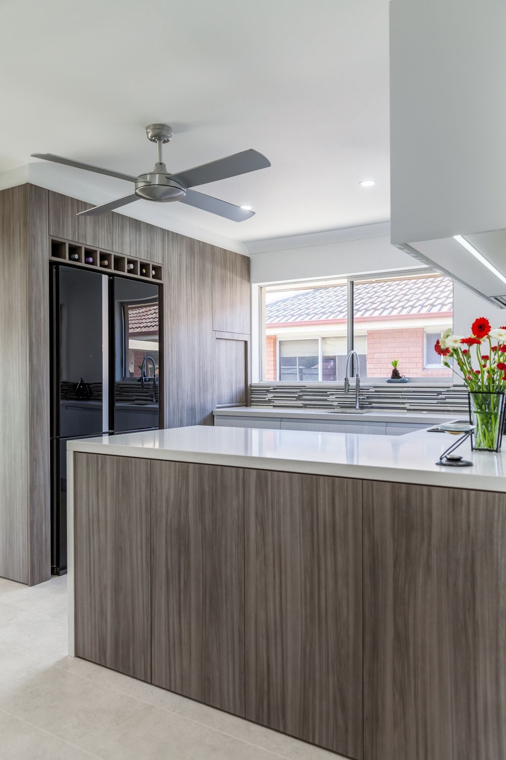 Modern Kitchen With Wood Cabinets — PKJ Design in Unanderra, NSW