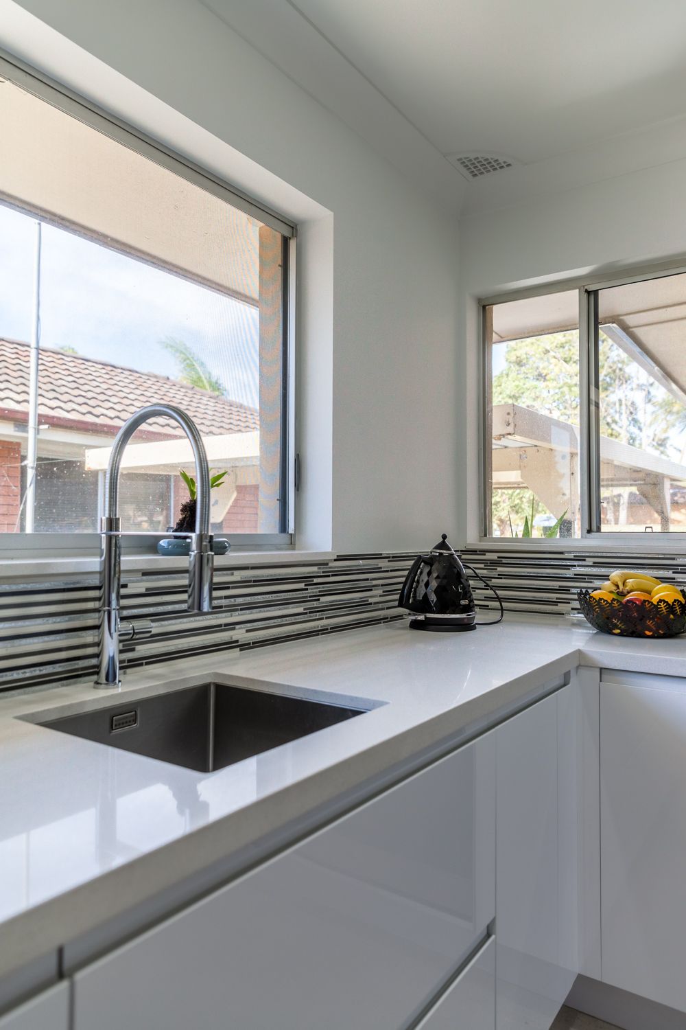 Modern Kitchen Corner With White Countertops — PKJ Design in Unanderra, NSW