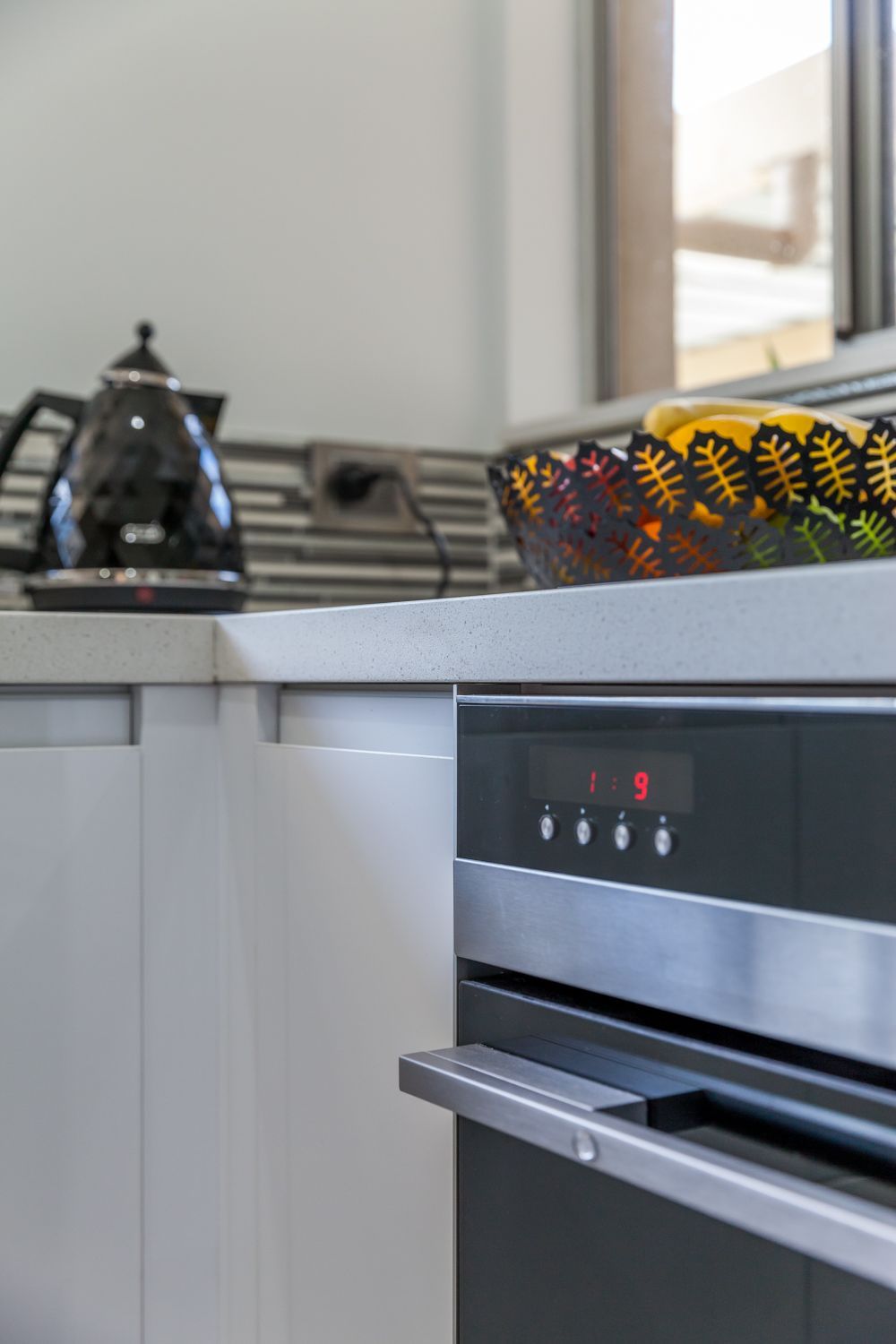 Kitchen Counter With Black Kettle, Patterned Basket — PKJ Design in Unanderra, NSW