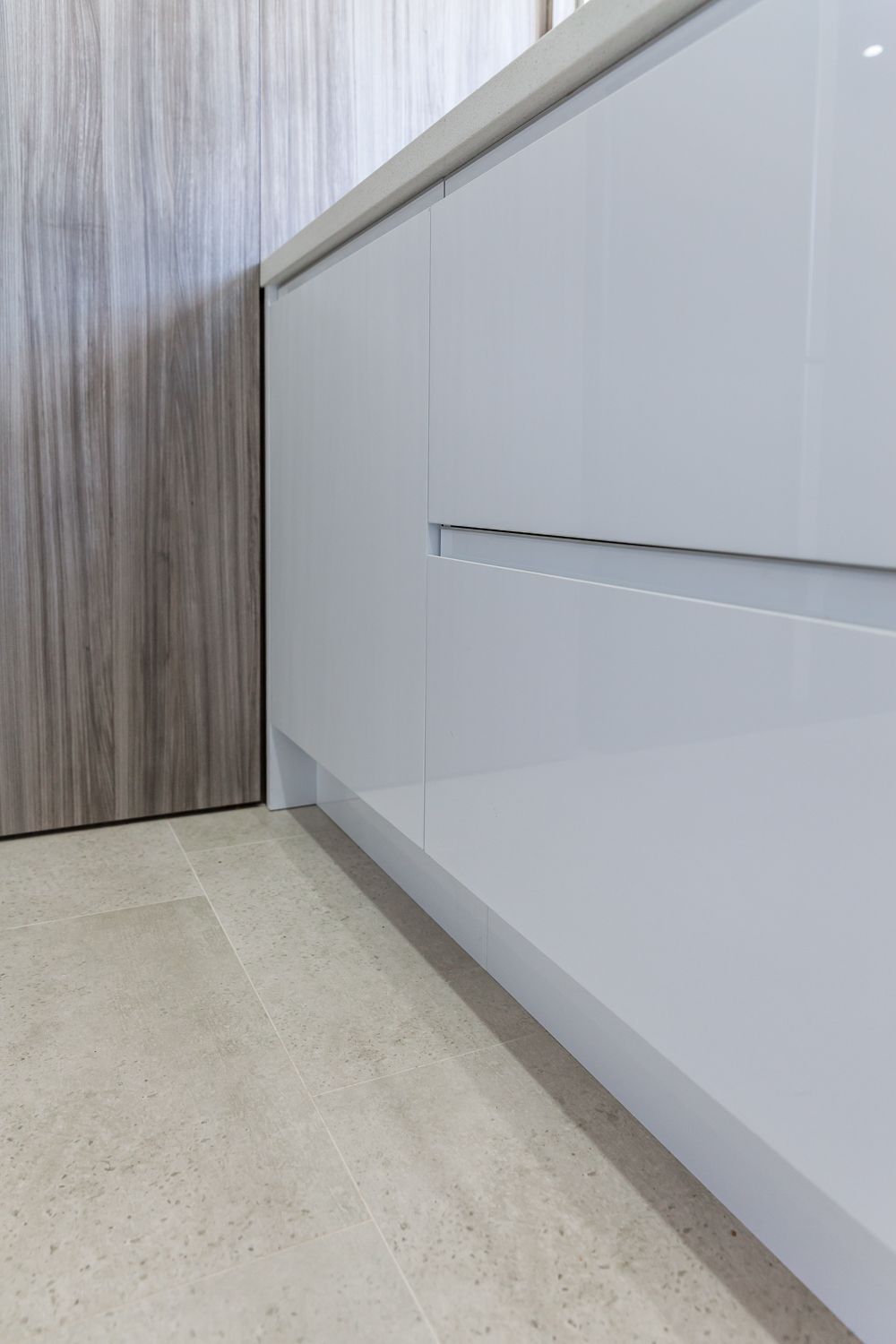 White Glossy Cabinet With a Recessed Handle — PKJ Design in Unanderra, NSW