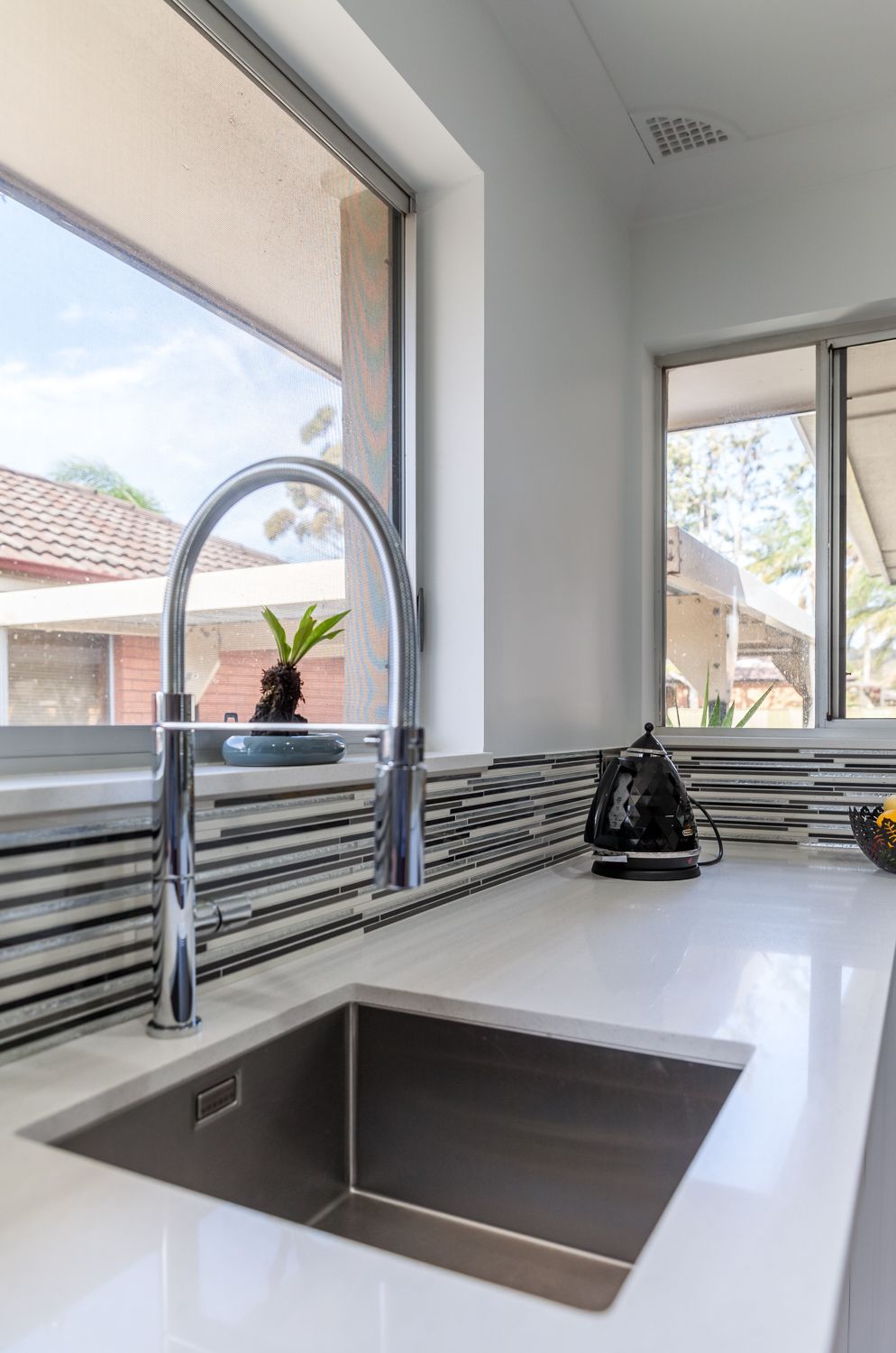 Modern Kitchen Sink With Chrome Faucet — PKJ Design in Unanderra, NSW