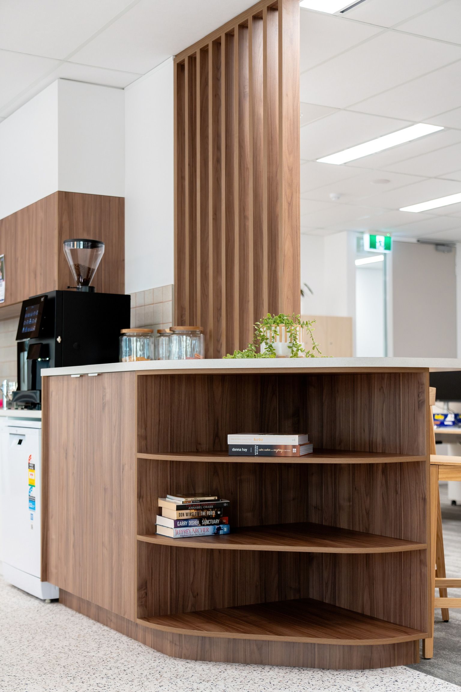 Office Reception Area With Wood-paneled Counter and Shelves — PKJ Design in Unanderra, NSW