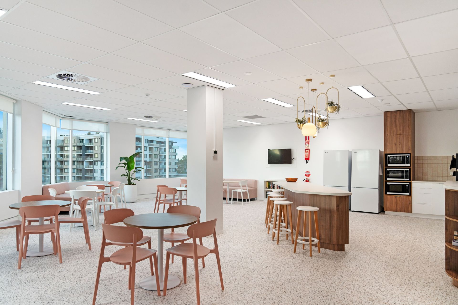 Bright Modern Kitchen and Dining Area With White Cabinets — PKJ Design in Unanderra, NSW