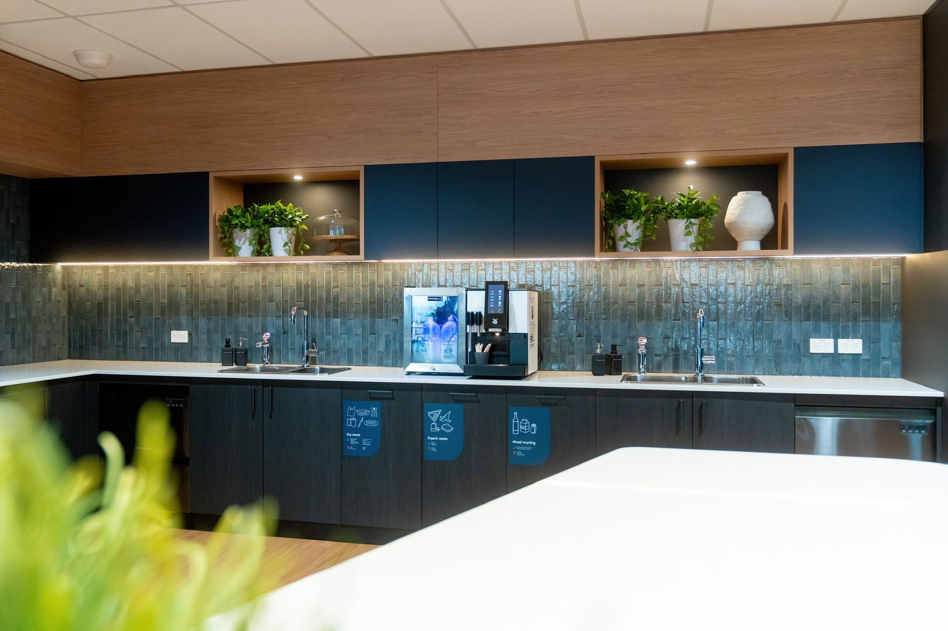Modern Office Break Room With Dark Cabinets — PKJ Design in Unanderra, NSW